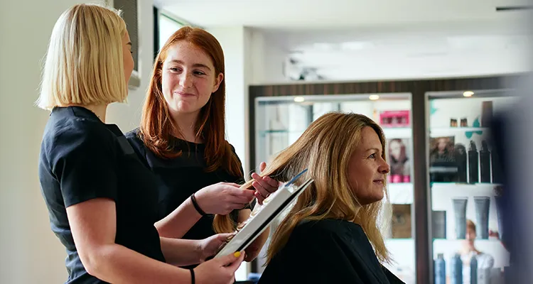 students working on a hair client